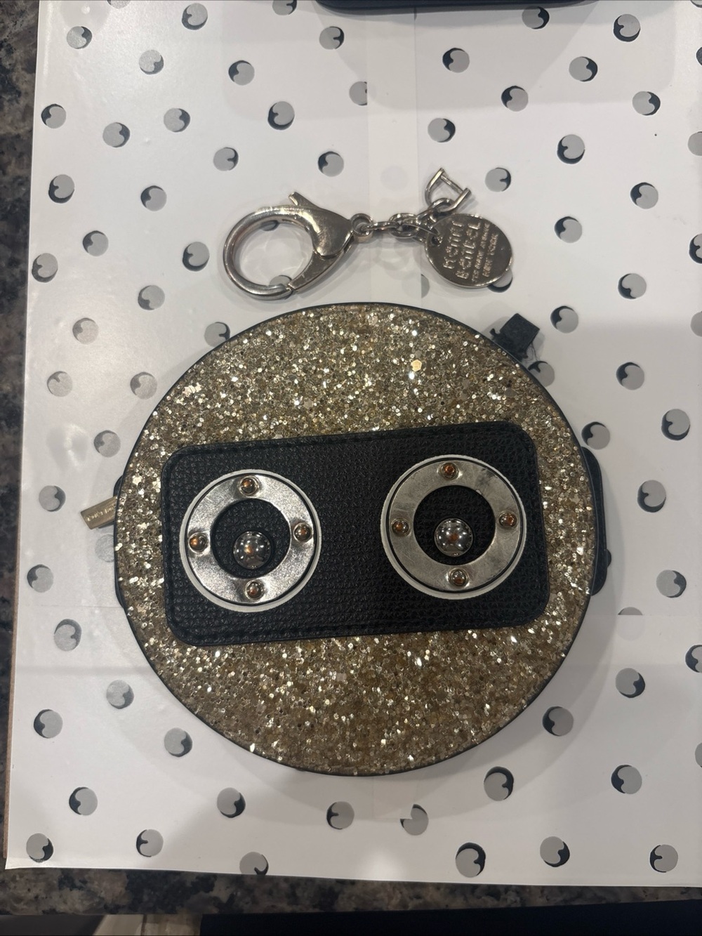 henri bendel Gold Glitter Round Mini Bag Keychain with Black Accent